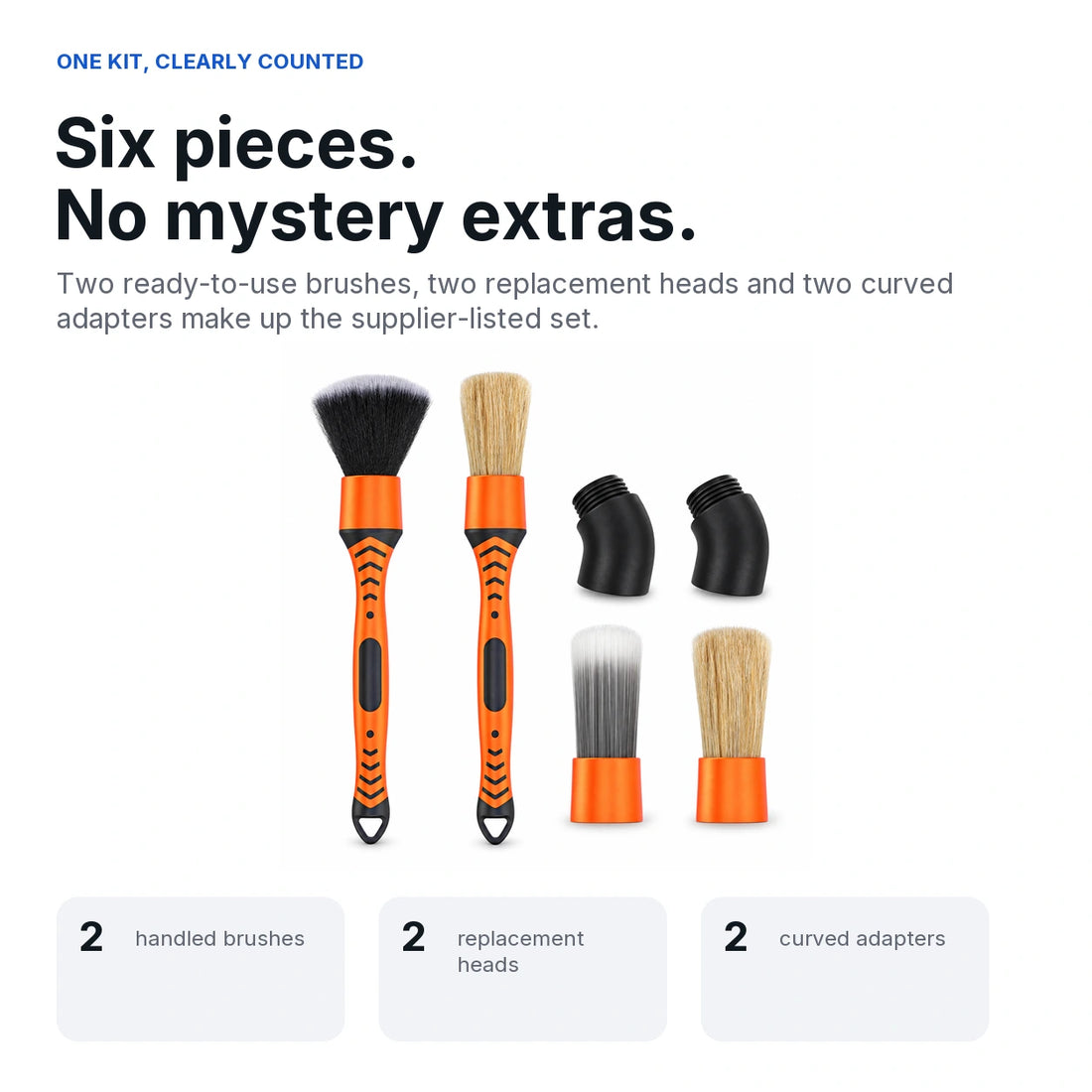 Complete orange and black six-piece car detailing brush kit on white: two handled brushes, two replacement heads and two curved adapters.
