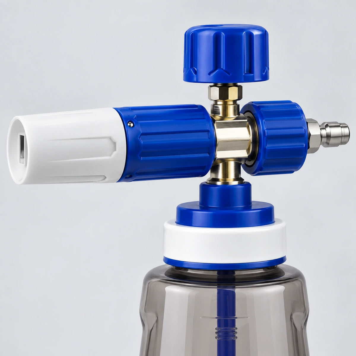 Close-up of the foam cannon upper assembly with top solution control, spray-pattern sleeve and stainless quick-connect plug.