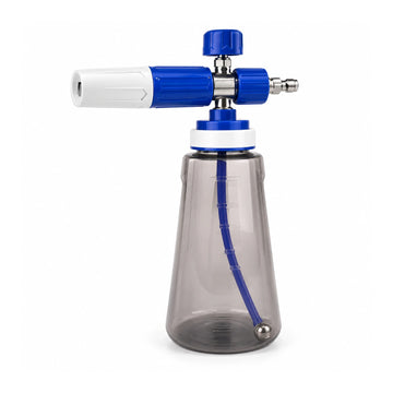Alpha 4.0 blue and white pressure washer foam cannon with smoky 1 L bottle and 1/4-inch quick-connect plug on white.