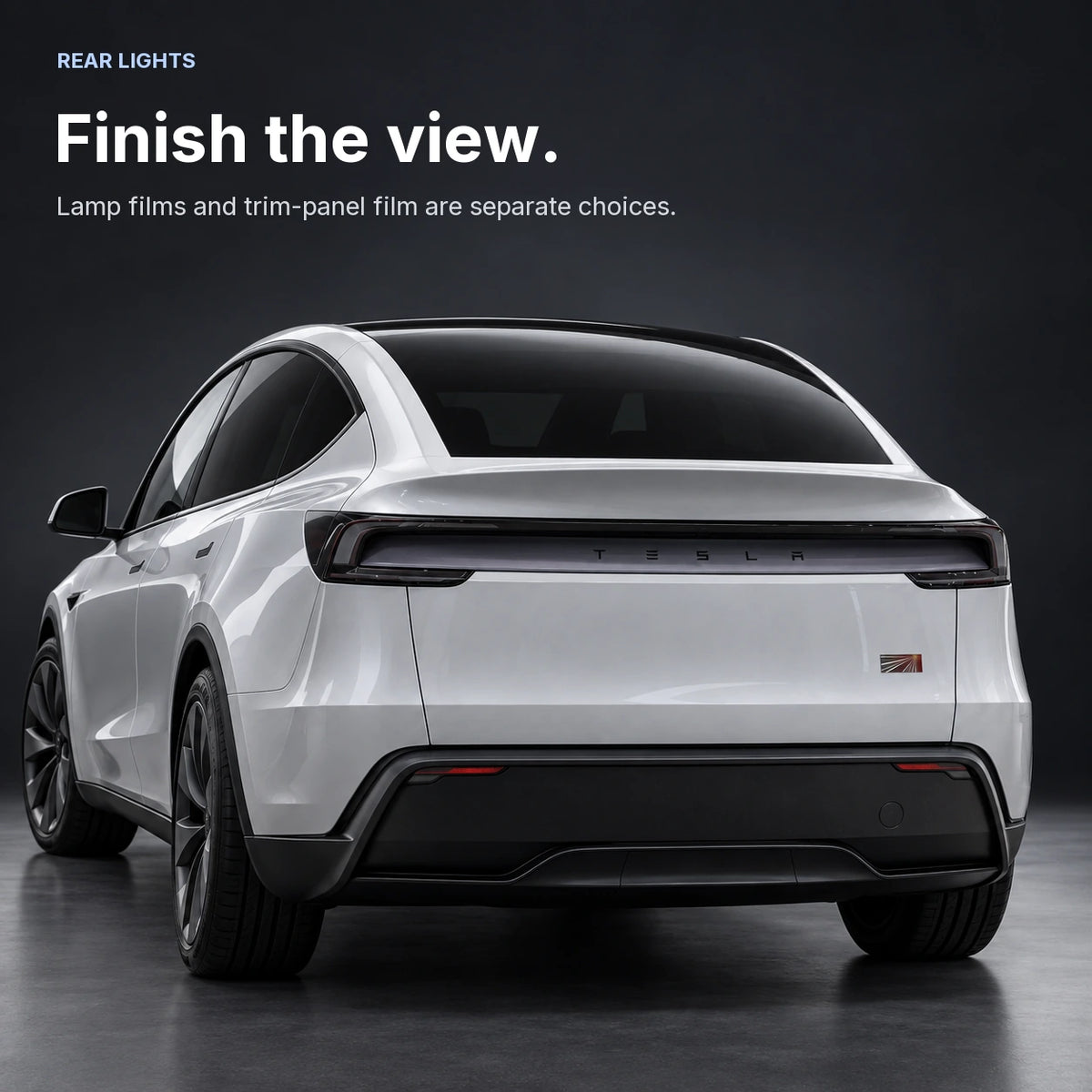 Illustrated rear view of Tesla Model Y Juniper showing the rear lamp outline and separate broad central trim panel.