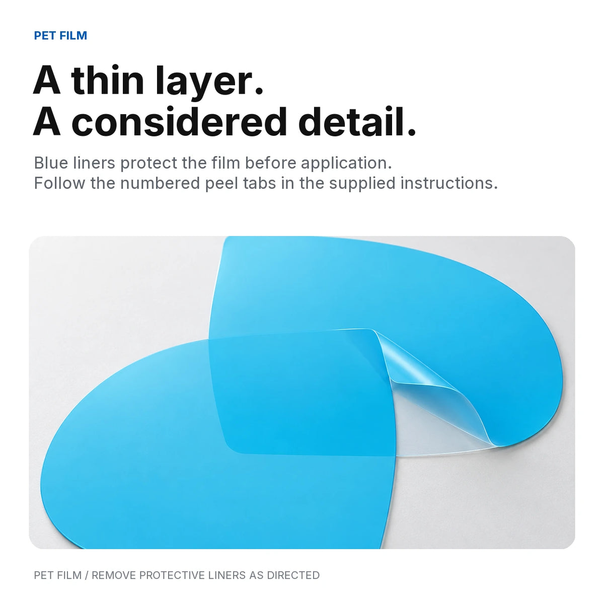 Illustrated PET mirror-film detail with a protective liner corner lifted; no measured thickness is claimed.
