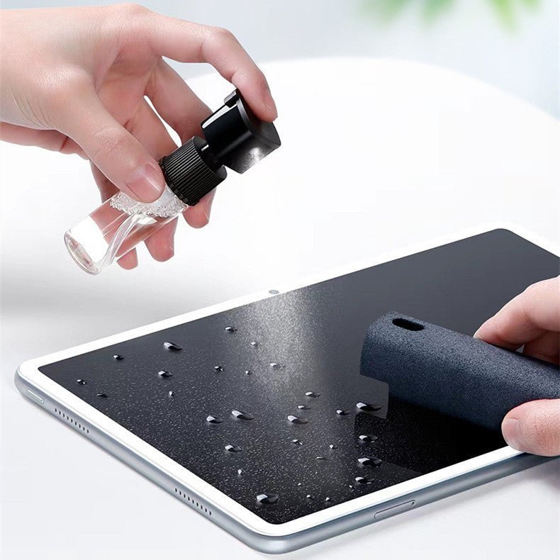 Removable screen-cleaner spray bottle and wiping sleeve beside a tablet